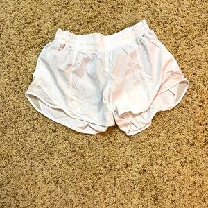 This a white pair of lululemon shorts. Barely used and size 6.
